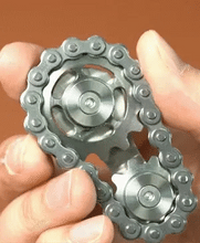 Load image into Gallery viewer, Rolling the spinner toy on a palm for finger exercise