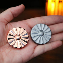 Load image into Gallery viewer, Hand holding daisy magnetic fidget coin for stress relief