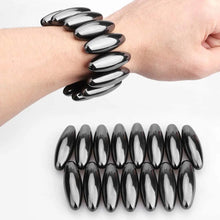 Load image into Gallery viewer, Black oval magnetic fidget balls worn on wrist