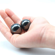 Load image into Gallery viewer, close up of black magnetic balls held in hand smooth polished surface
