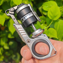 Charger l'image dans la galerie, Metal ratchet fidget slider shown in hand at an angle
