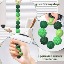 Cargar imagen en el visor de la galería, Silicone-covered magnetic balls for rolling and tactile play

